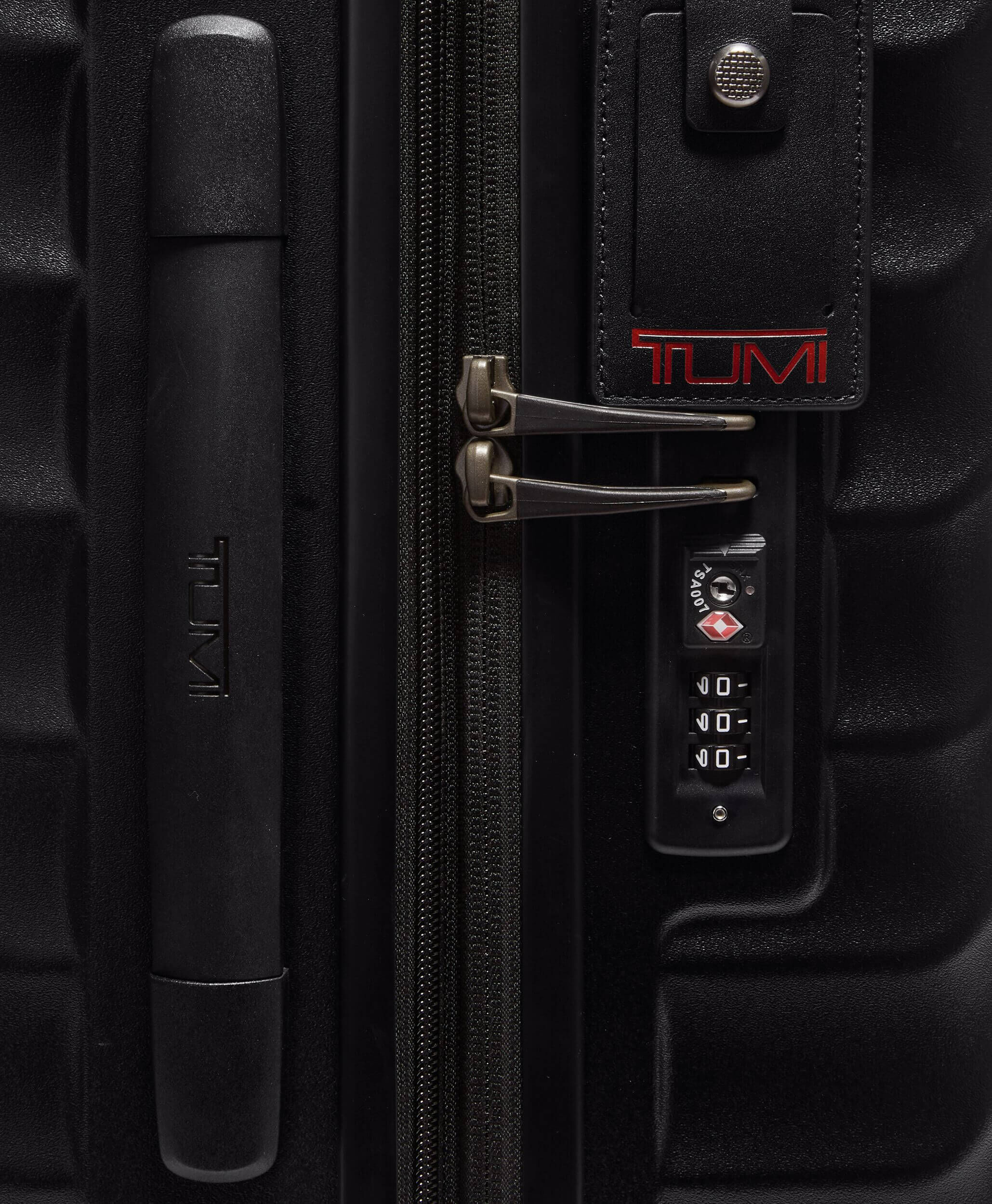 Tumi black luggage top